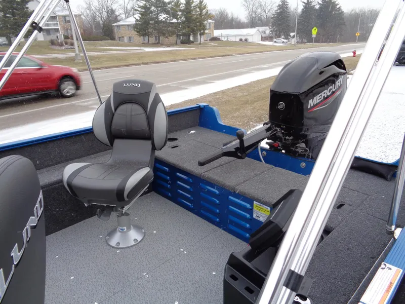 Slide: The Image of 2024 Lund 1650 Angler Tiller boat interior with Mercury outboard motor. - 12