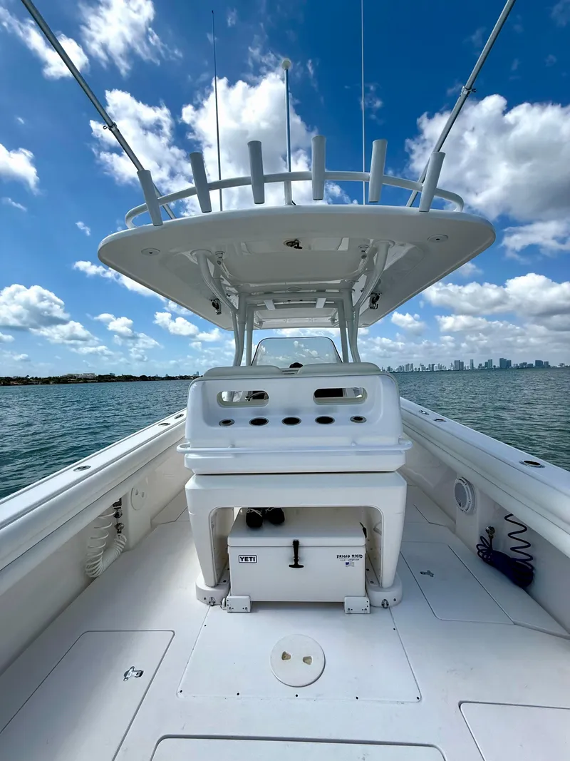 Slide: The Image of 2015 Intrepid 375 Center Console boat on open water under blue sky. - 16