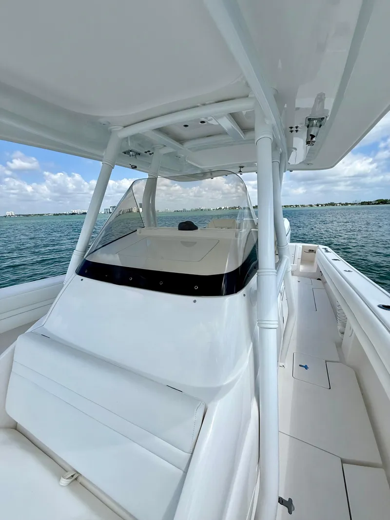 Slide: The Image of 2015 Intrepid 375 Center Console boat on calm water under a clear sky. - 20