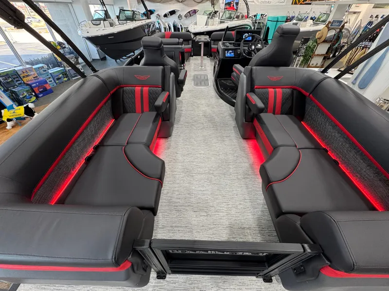 Slide: The Image of 2025 Bennington M Quad Bench 24 MFB interior with sleek black and red seating. - 10