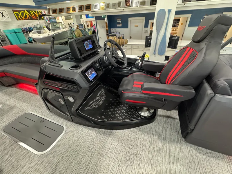Slide: The Image of Interior of 2025 Bennington M Quad Bench 24 MFB boat with modern dashboard and seating. - 11