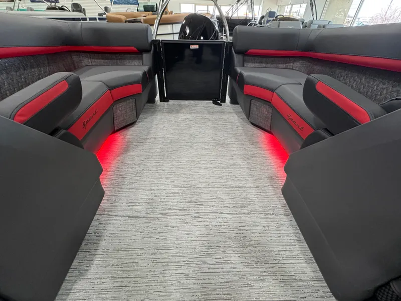Slide: The Image of 2025 Bennington M Quad Bench 24 MFB interior with red accent lighting and gray upholstery. - 12