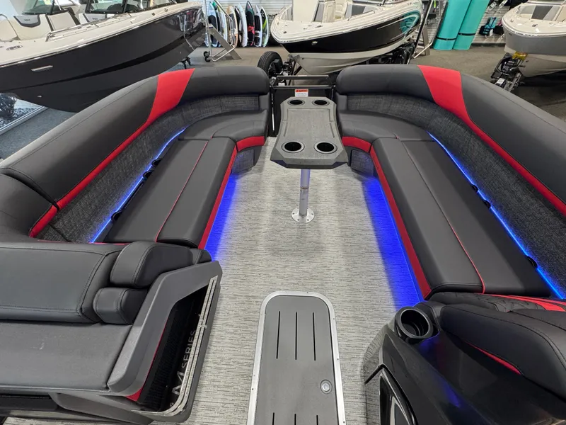 Slide: The Image of 2025 Bennington M Quad Bench 24 MFB boat interior with LED lighting and seating. - 14