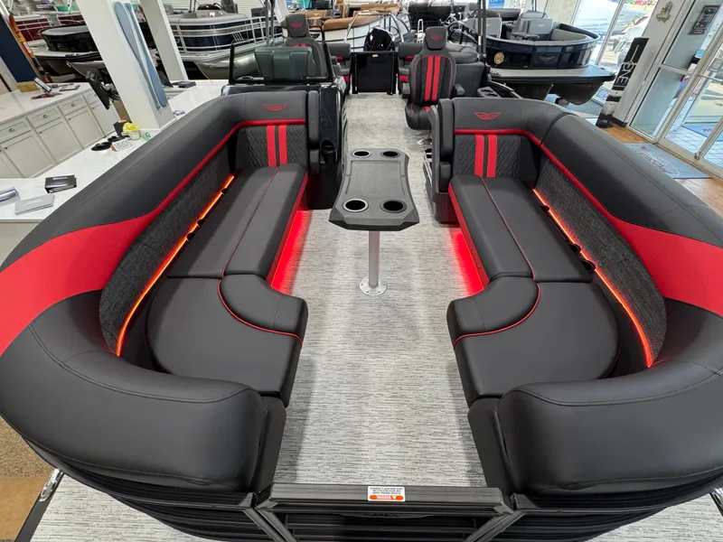 Slide: The Image of 2025 Bennington M Quad Bench 24 MFB with sleek black and red seating, illuminated accents. - 18