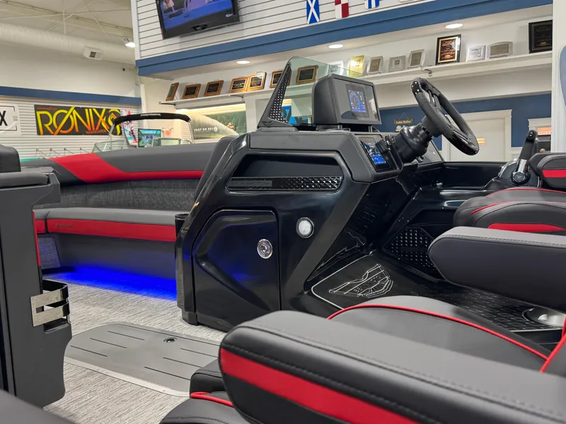 Slide: The Image of 2025 Bennington M Quad Bench 24 MFB interior with modern dashboard and seating. - 26