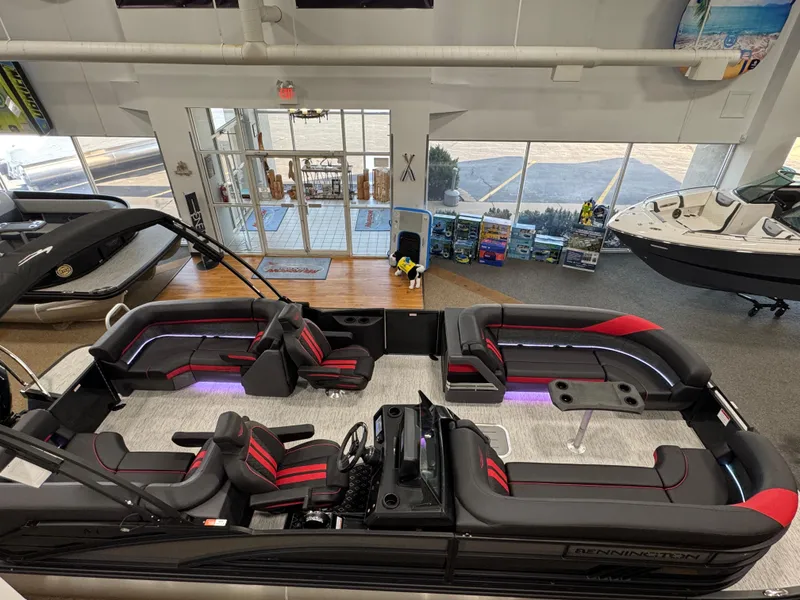 Slide: The Image of 2025 Bennington M Quad Bench 24 MFB pontoon boat interior with modern seating and ambient lighting. - 28