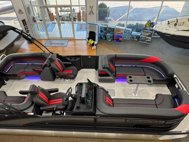 Slide: The Image of 2025 Bennington M Quad Bench 24 MFB pontoon boat with modern seating and ambient lighting. - 29