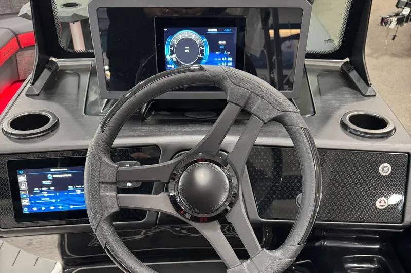 Slide: The Image of 2025 Bennington M Quad Bench 24 MFB dashboard with modern steering and digital displays. - 30