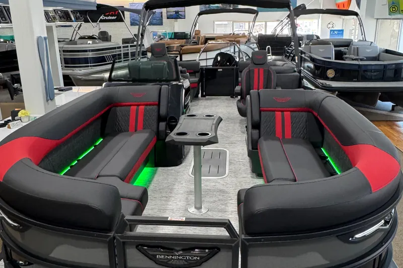 Slide: The Image of 2025 Bennington M Quad Bench 24 MFB pontoon boat with stylish seating and ambient lighting. - 35