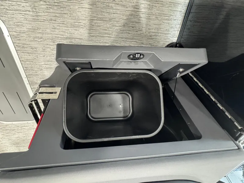 Slide: The Image of Open storage compartment in 2025 Bennington M Quad Bench 24 MFB. - 7