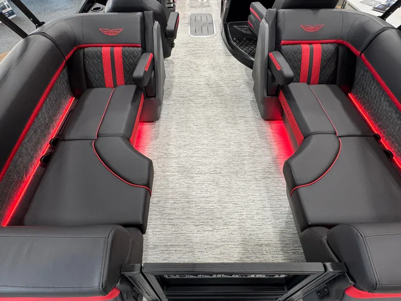 Slide: The Image of 2025 Bennington M Quad Bench 24 MFB interior with sleek black and red seating. - 9