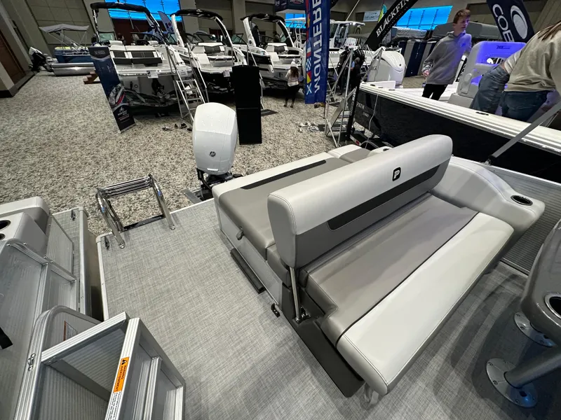 Slide: The Image of 2025 Princecraft Vectra 21 RL pontoon boat interior with seating and motor display. - 8
