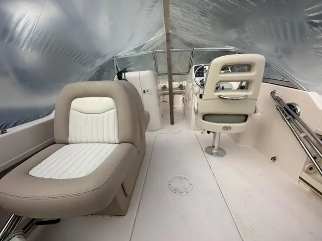 Slide: The Image of 2014 Grady-White 225 Freedom boat interior with seating and steering console. - 5