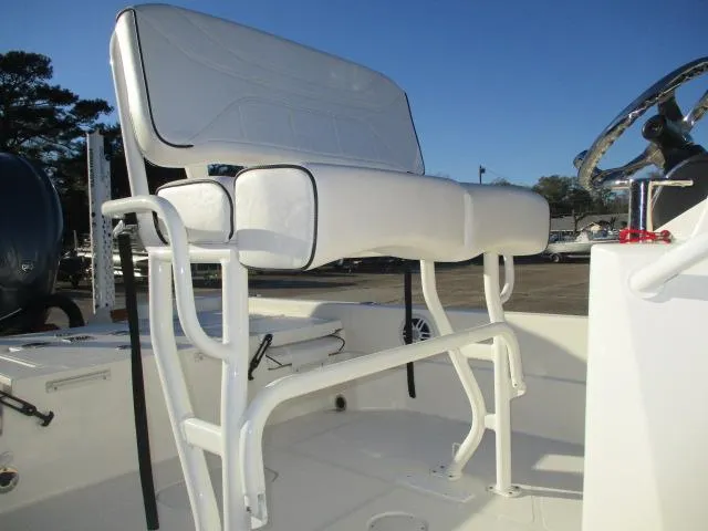 Slide: The Image of 2022 Skeeter SX240 boat seat with white upholstery and sturdy frame. - 6