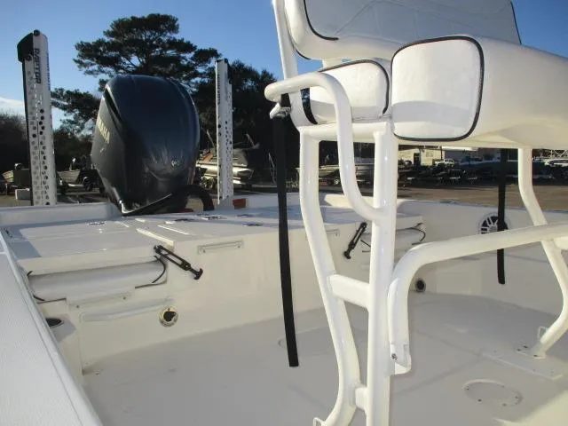 Slide: The Image of 2022 Skeeter SX240 boat interior with seating and outboard motor. - 7