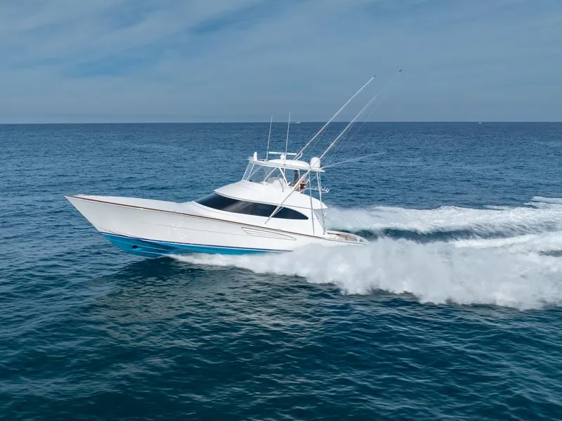Slide: The Image of 2025 Viking 64 Convertible yacht cruising on open ocean waters. - 33