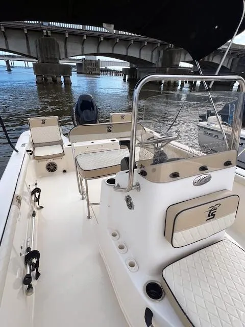 Slide: The Image of 2020 Carolina Skiff 21 LS boat interior with bridge in background. - 5