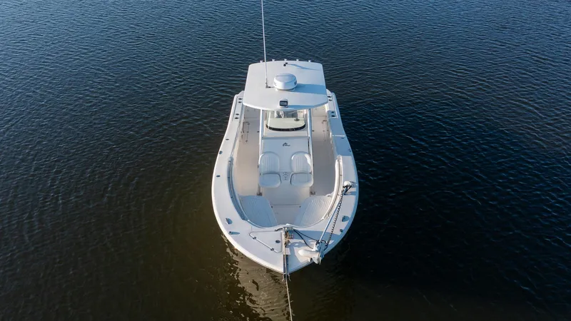 Slide: The Image of 2012 Sea Fox 286 Commander boat on calm water, aerial view. - 10