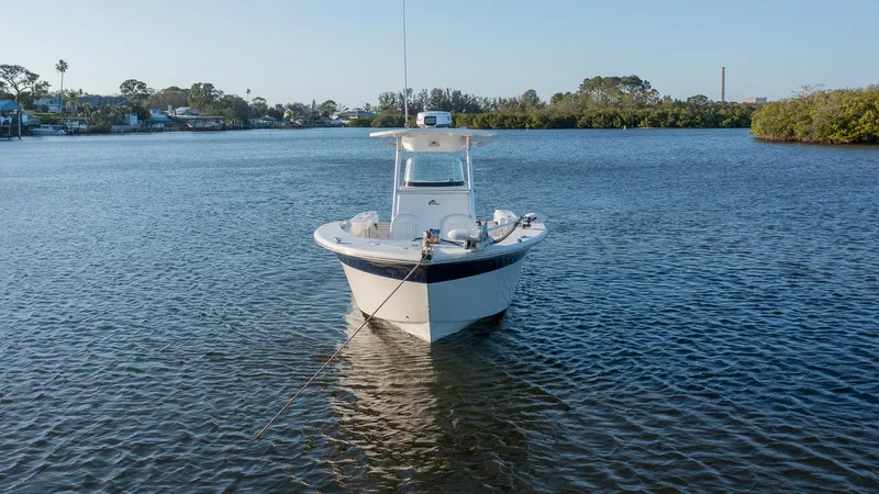 Slide: The Image of 2012 Sea Fox 286 Commander boat anchored on calm water. - 2