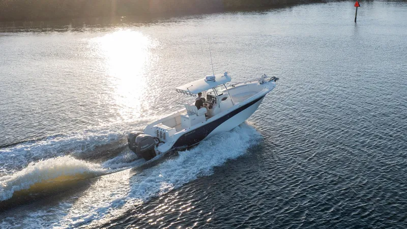 Slide: The Image of 2012 Sea Fox 286 Commander cruising on open water at sunset. - 20