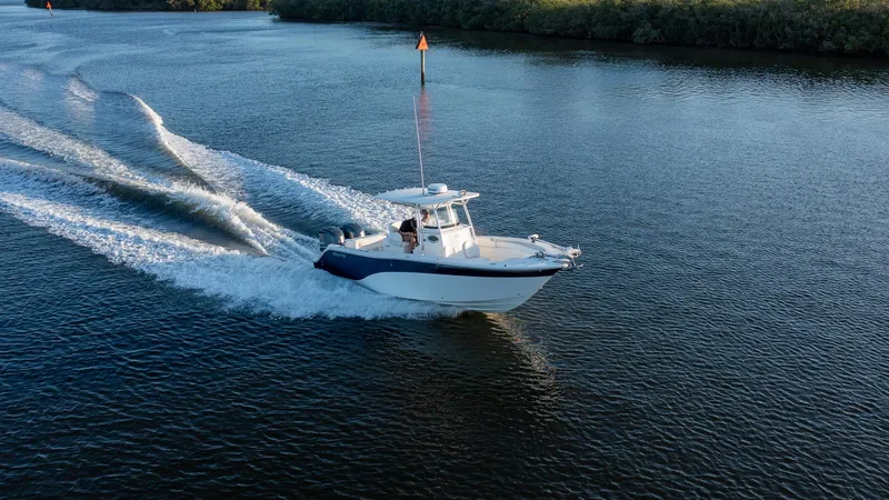 Slide: The Image of Sea Fox 286 Commander 2012 cruising on a calm river, creating a wake. - 22