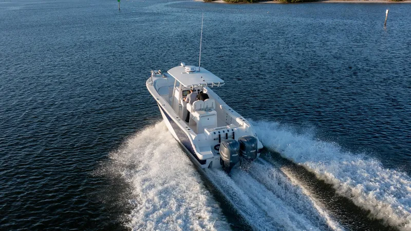 Slide: The Image of 2012 Sea Fox 286 Commander cruising on open water, rear view. - 25