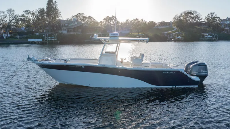 Slide: The Image of 2012 Sea Fox 286 Commander boat on calm water at sunset. - 3