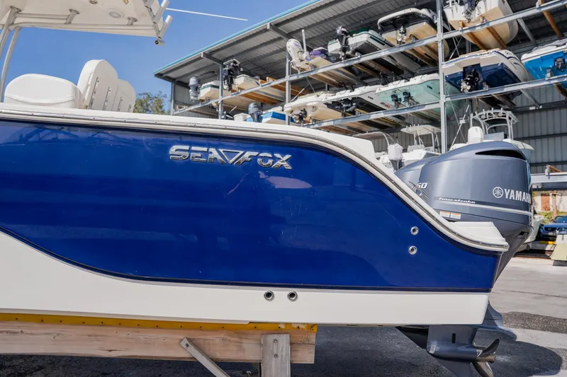 Slide: The Image of 2012 Sea Fox 286 Commander boat with Yamaha engine in storage facility. - 35