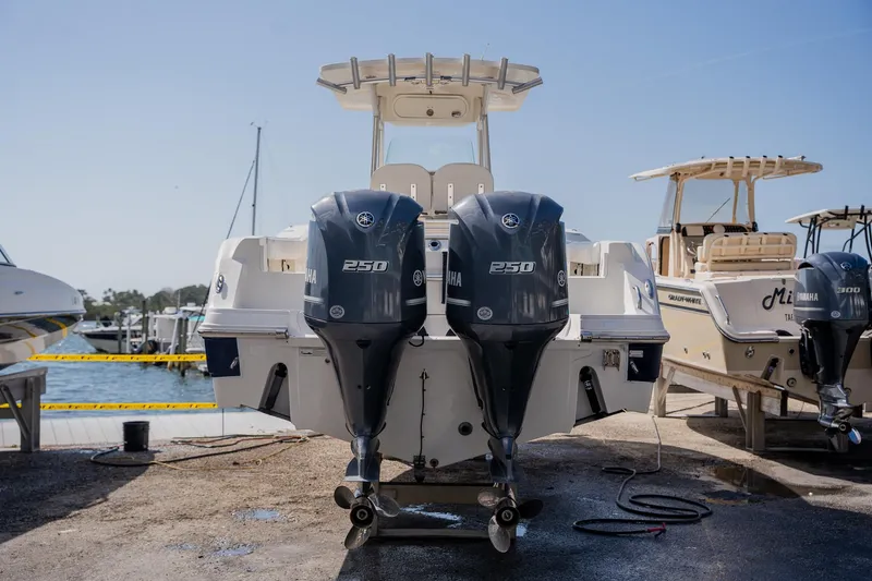 Slide: The Image of 2012 Sea Fox 286 Commander boat with twin 250 horsepower engines at a marina. - 36