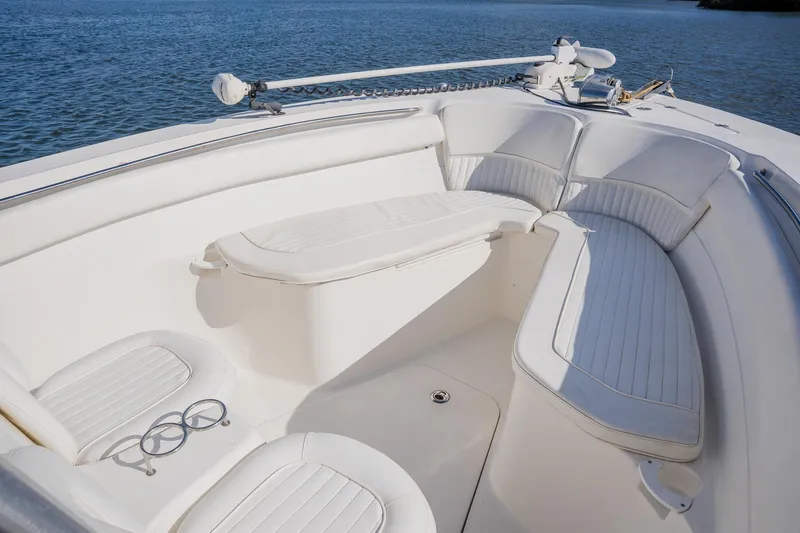 Slide: The Image of 2012 Sea Fox 286 Commander boat interior with white seating and ocean view. - 44