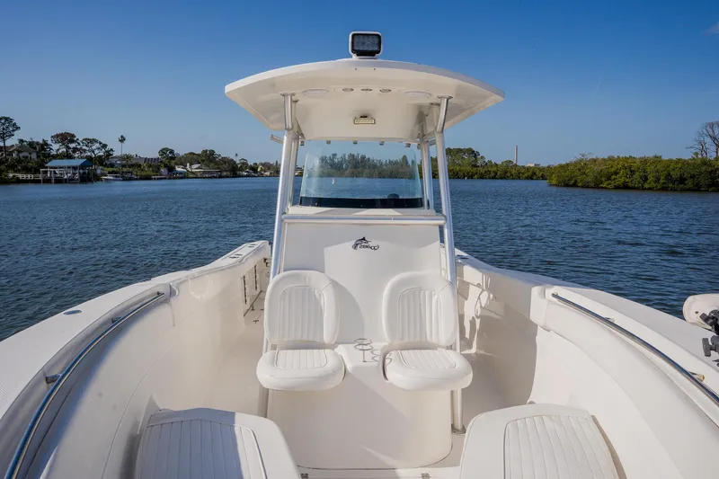 Slide: The Image of 2012 Sea Fox 286 Commander boat on calm water, featuring dual seating and a sleek design. - 47