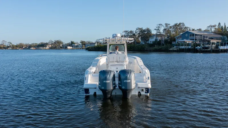 Slide: The Image of 2012 Sea Fox 286 Commander boat on calm water with dual engines. - 5
