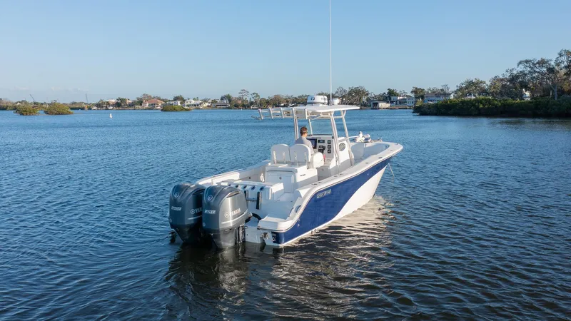 Slide: The Image of 2012 Sea Fox 286 Commander boat on calm water with dual engines. - 6
