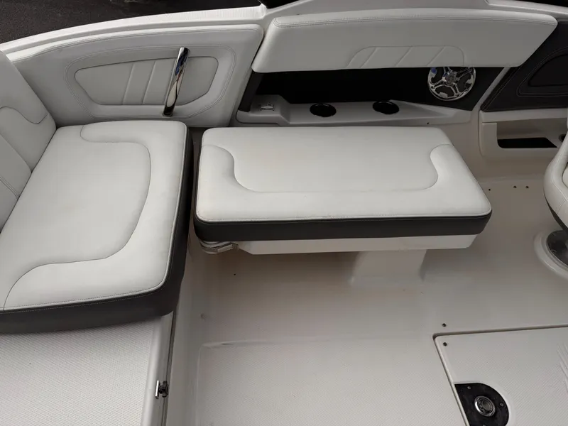 Slide: The Image of 2013 Chaparral 257 SSX boat interior with white seating and modern design. - 12