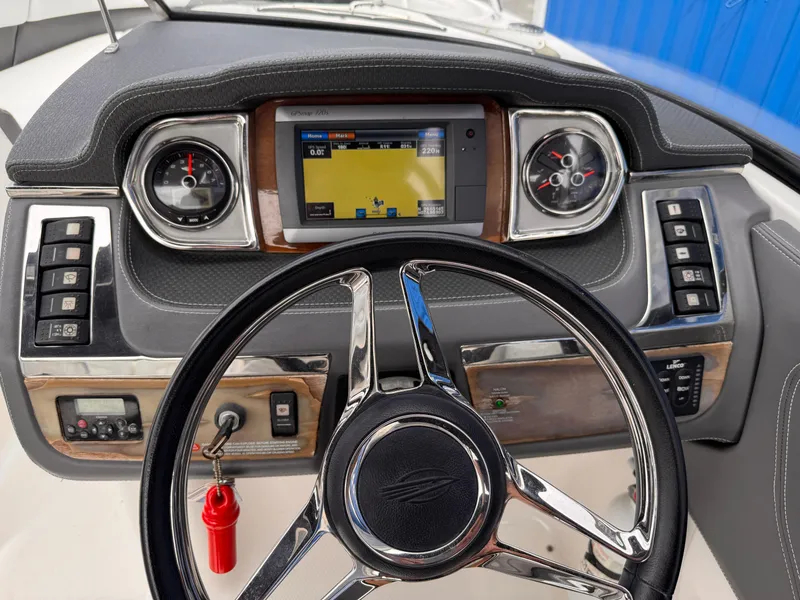 Slide: The Image of Control panel of a 2013 Chaparral 257 SSX boat with key and warning label. - 19