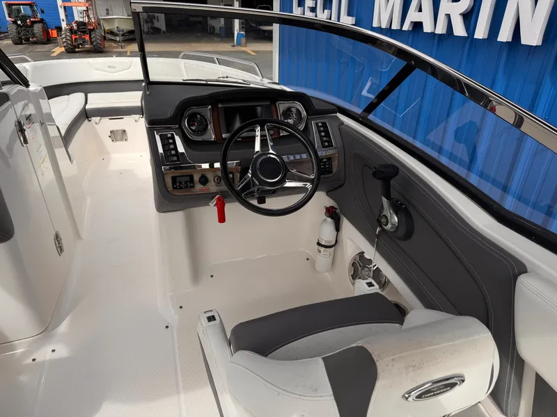 Slide: The Image of 2013 Chaparral 257 SSX boat interior with white and black seating. - 26