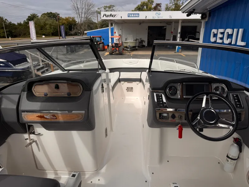 Slide: The Image of 2013 Chaparral 257 SSX boat interior with sleek seating and modern dashboard. - 28