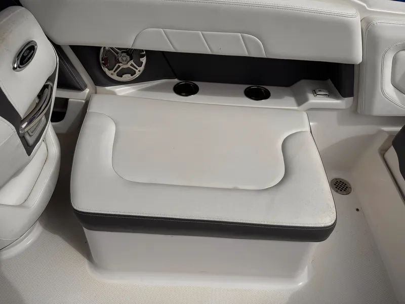 Slide: The Image of 2013 Chaparral 257 SSX boat storage compartment with cooler inside. - 30