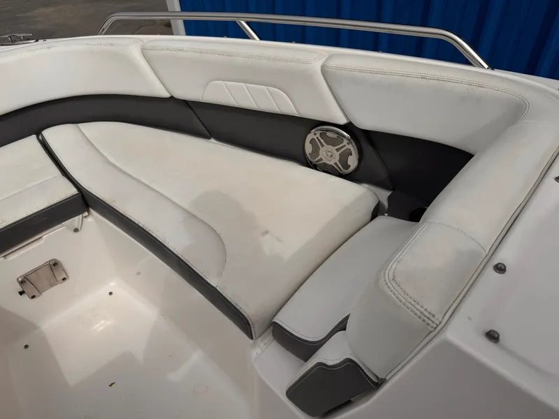 Slide: The Image of 2013 Chaparral 257 SSX boat interior with steering wheel and seating. - 32