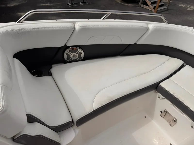 Slide: The Image of 2013 Chaparral 257 SSX boat interior with white and black seating. - 34