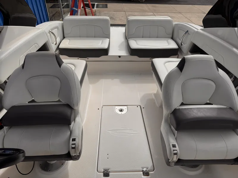 Slide: The Image of 2013 Chaparral 257 SSX boat interior with gray and black seating. - 36