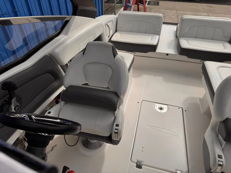 Slide: The Image of 2013 Chaparral 257 SSX boat interior with white seating and modern design. - 37
