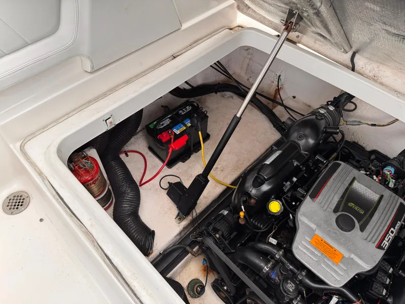 Slide: The Image of 2013 Chaparral 257 SSX engine compartment with visible components and wiring. - 46