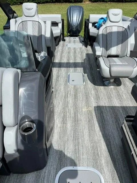 Slide: The Image of 2025 Veranda Relax VR22RC pontoon boat interior with gray seating and flooring. - 10