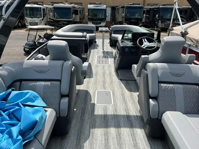 Slide: The Image of 2025 Veranda Relax VR22RC pontoon boat interior with luxurious seating and modern dashboard. - 12