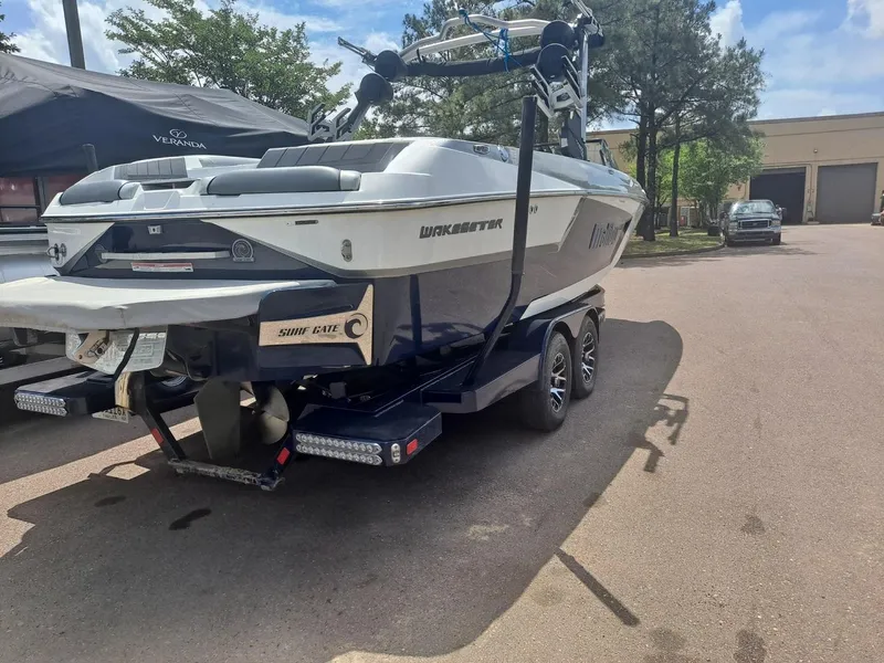 Slide: The Image of 2025 Veranda Relax VR22RC boat on trailer, parked outdoors. - 5