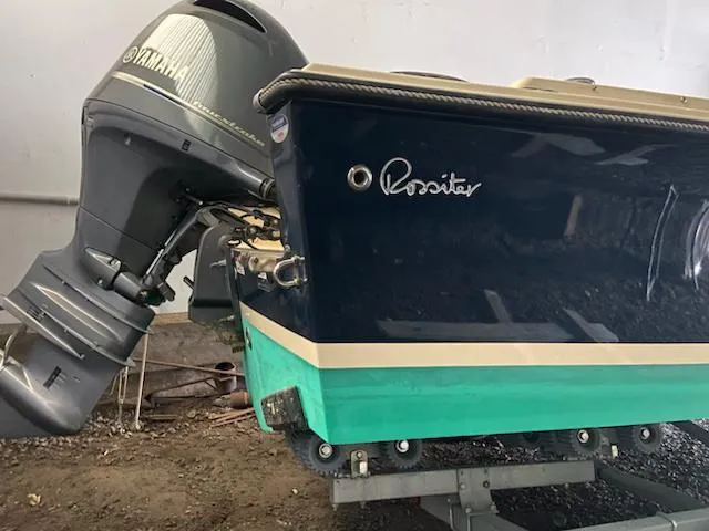 Slide: The Image of 2018 Rossiter 20 Coastal Cruiser with Yamaha outboard motor, displayed on a trailer. - 12