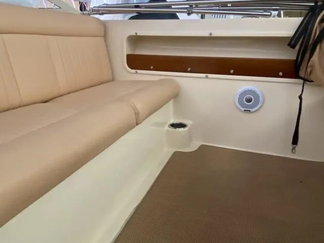 Slide: The Image of 2018 Rossiter 20 Coastal Cruiser interior with beige seating and storage compartment. - 4