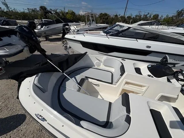 Slide: The Image of 2023 Bayliner Element M17 boat with seating, displayed outdoors. - 4