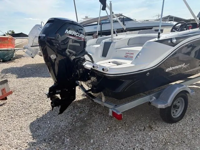 Slide: The Image of 2023 Bayliner Element M17 boat with Mercury outboard motor on a trailer. - 6